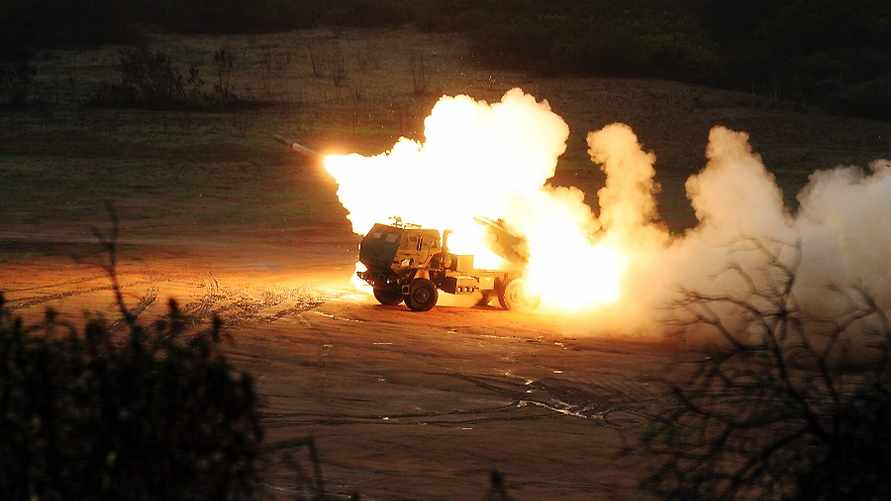 U.S. Marines with 1st Battalion, 11th Marine Regiment, fire a M142 High Mobility Artillery Rocket System (HIMARS), a truck mounted multiple-rocket launcher system, during exercise Steel Knight at Marine Corps Base Camp Pendleton, Calif., Dec. 13, 2012. The battalion conducted this historic live-fire exercise, simultaneously utilizing HIMARS, M777 Lightweight Howitzer and Expeditionary Fire Support System. This is the first time all three artillery weapons systems were fired during the same exercise. (DoD photo by LCpl Joseph Scanlan, U.S. Marine Corps/Released)