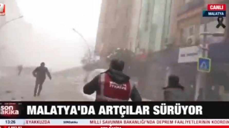 Появилось видео, как люди бегут по улице падающих зданий в Турции