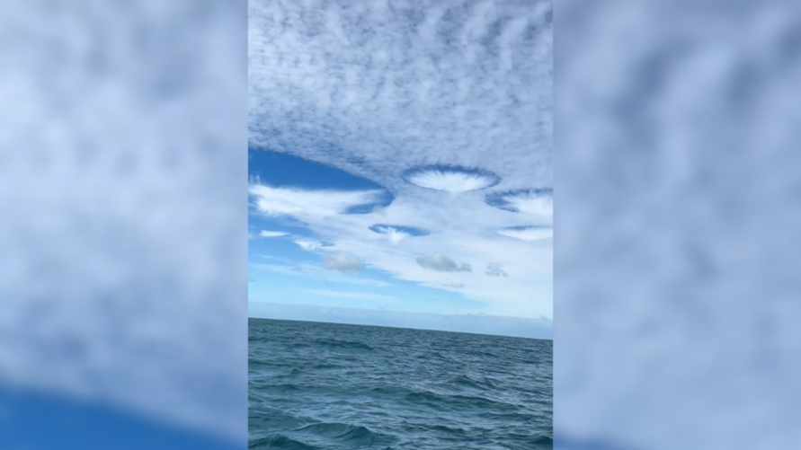 Следы НЛО? Рыбаки сняли на видео гигантские "дырявые облака". В NASA объяснили, что это